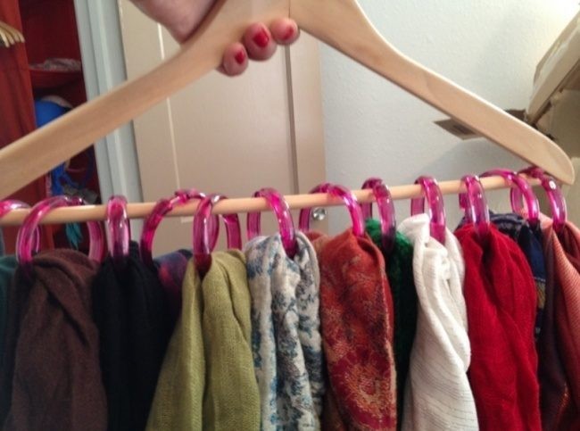 Shower rings and old hanger can help yout store your scarves. 